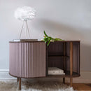 Umage Mini EOS Feather Lampshade in White on a Tripod Lamp on a sideboard